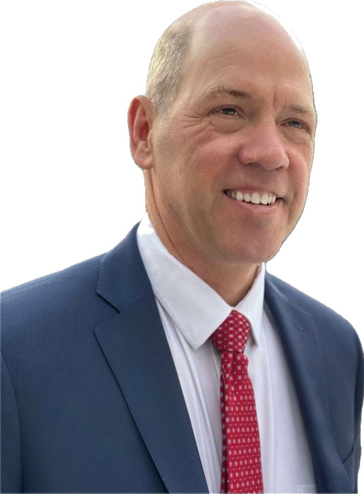 A statue of justice is sitting next to a wooden gavel and scales of justice.