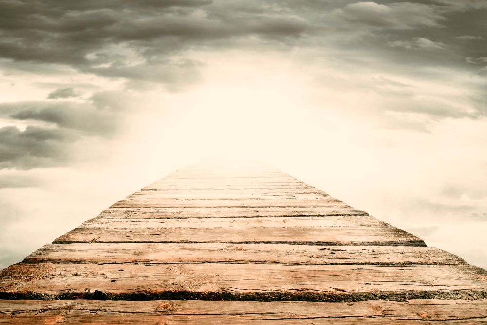 A wooden bridge leading off into a cloud — Territory Funerals In Yarrawonga, NT