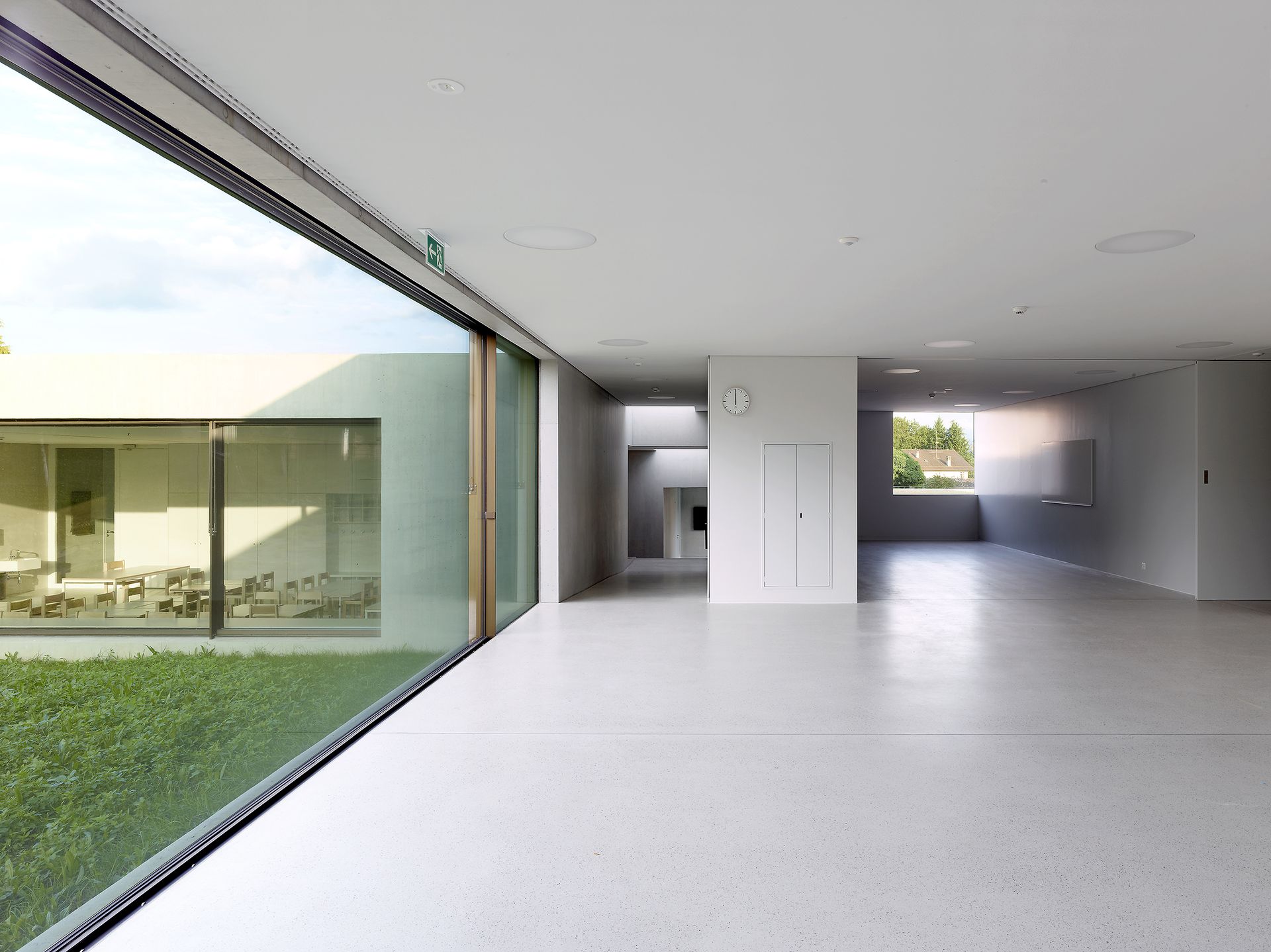 Bright hallway in a modern house with minimalist window frames and sophisticated architecture