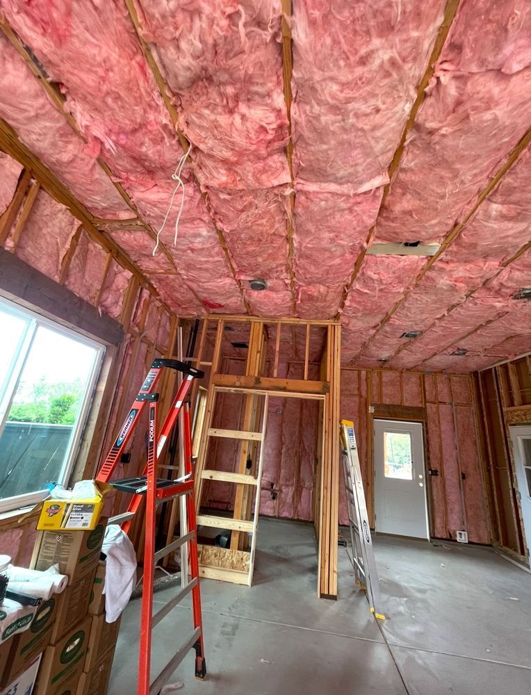 Pink insulation in ceiling and walls. 