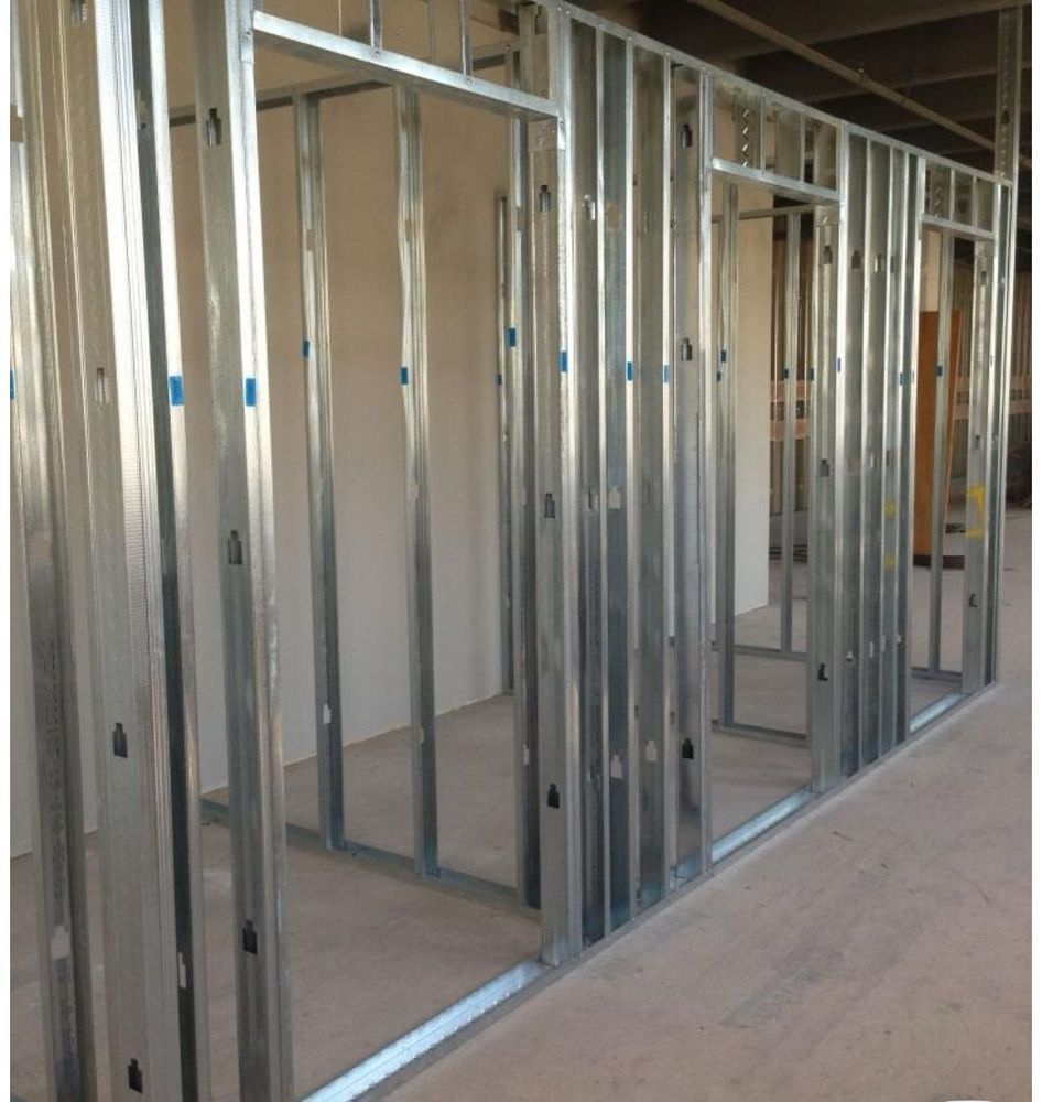 Metal studs framing interior walls with doorways.