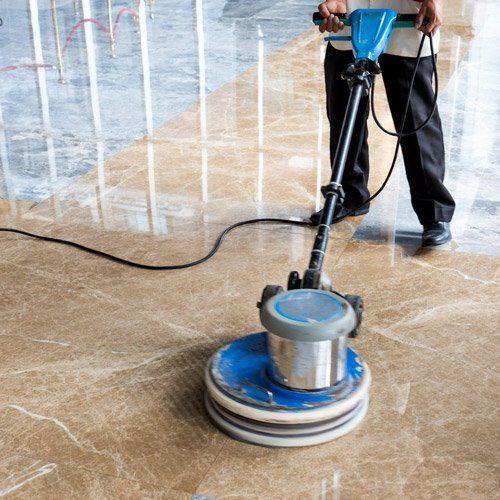 person sealing marble floor