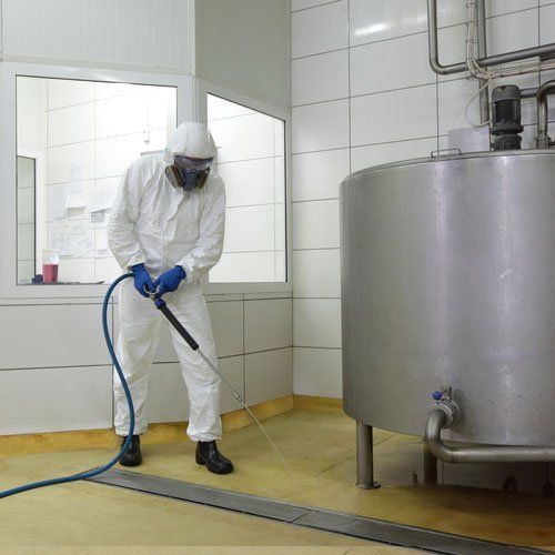 person cleaning factory