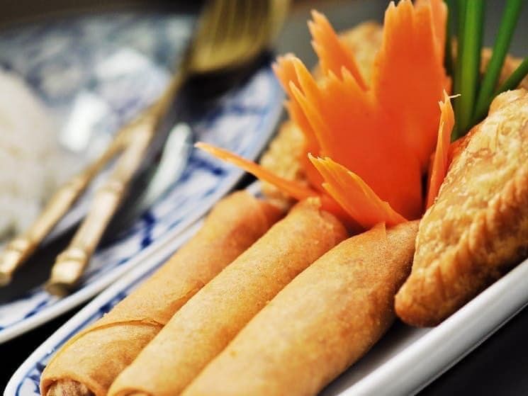 a Close Up of a Plate of Food With a Flower on Top — Thai Satay Hut In Lismore, NSW