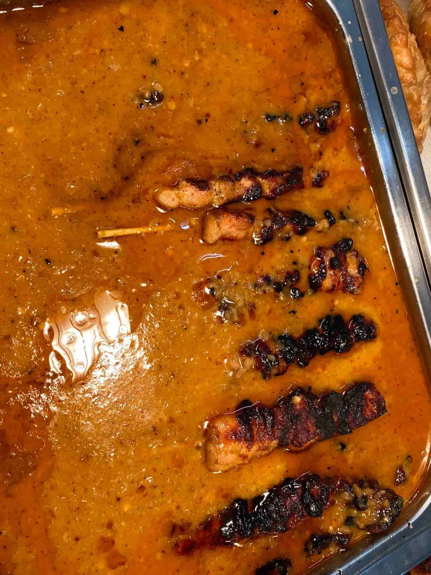 a Close Up of a Tray of Food With Meat and Sauce — Thai Satay Hut In Lismore, NSW