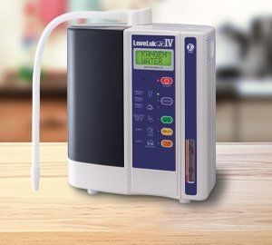 Tools on top of a water heater: wrench, screwdriver, pliers, pipes, and a red valve.