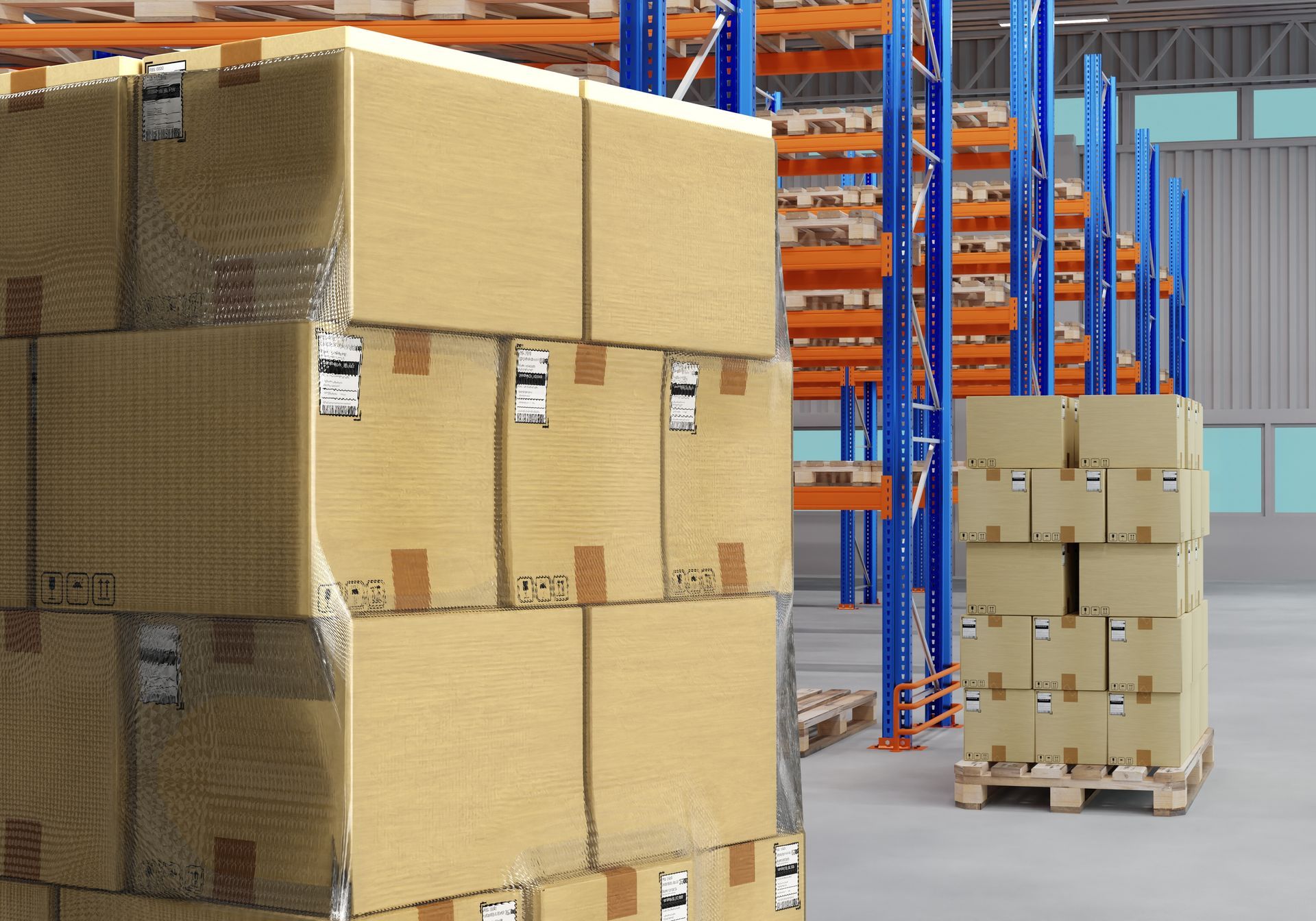 Warehouse aisle with stacked cardboard boxes on pallets and blue/orange shelving racks