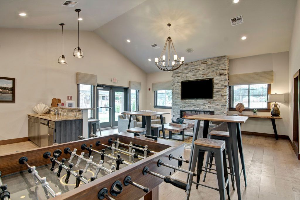 there is a foosball table in the middle of the room .