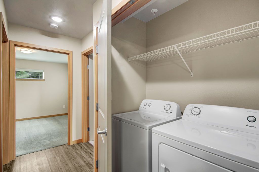 a laundry room with a washer and dryer in a house .