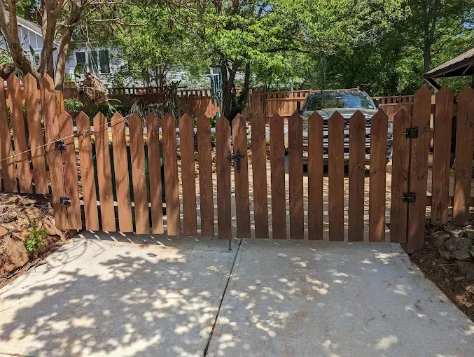 A gated entrance to a residential area with a speed limit of 25