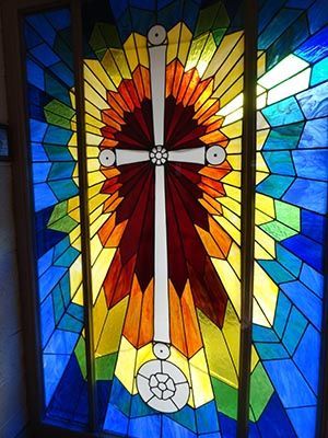 Stained glass cross in vestibule
