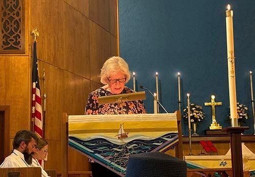 Reader reading scripture during service