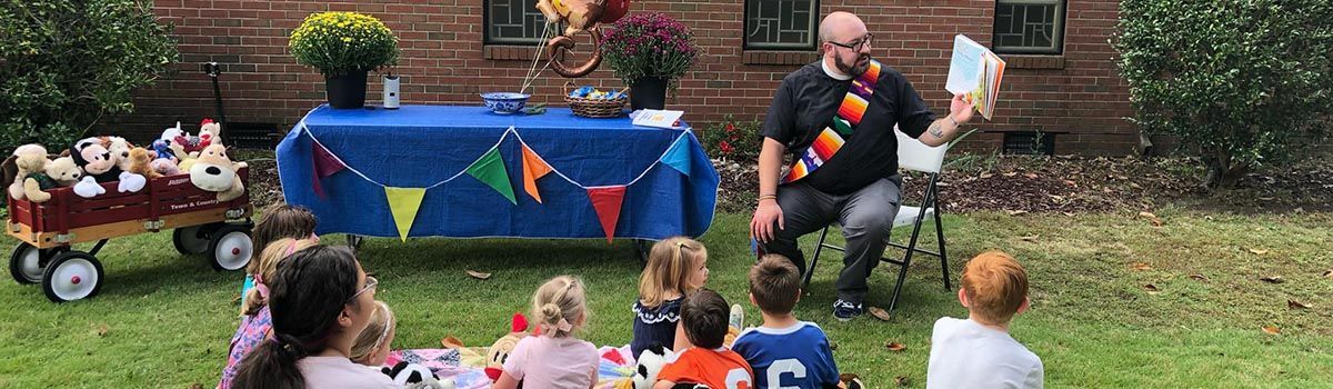 Rev. Matt reading to kids