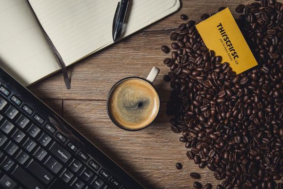 Close up of white coffee cup filled with premium coffee