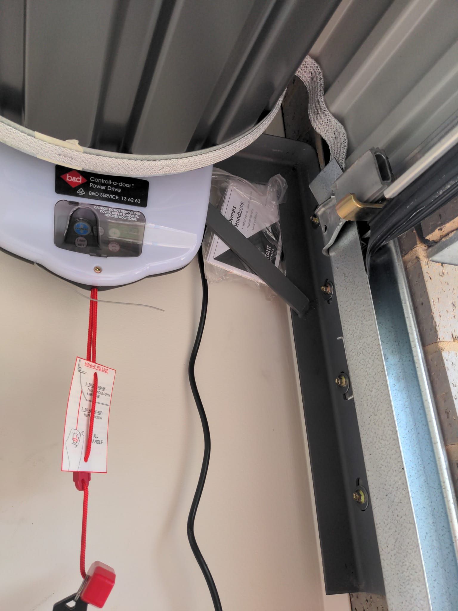 A close up of a garage door opener in a garage  — Goldfields Garage Doors & Gates in Wendouree, VIC