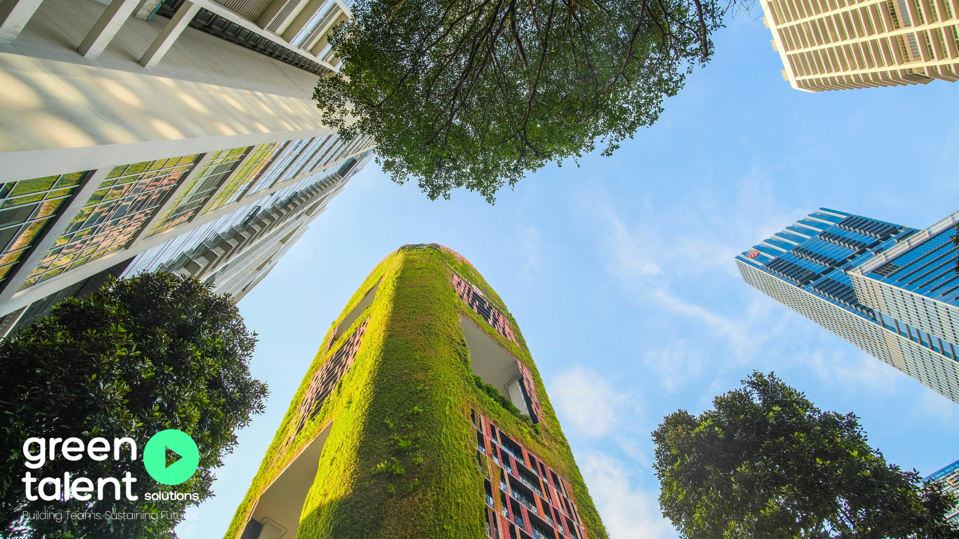 High buildings with plants and grass covering them