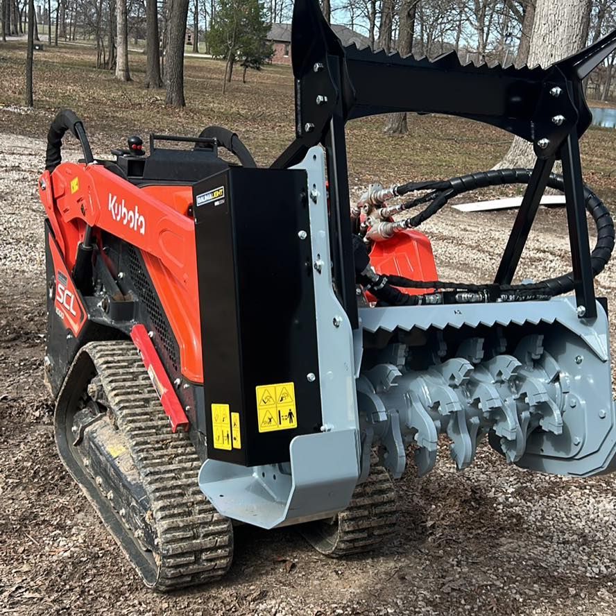 A group of women are standing in a living room wearing matching hoodies.