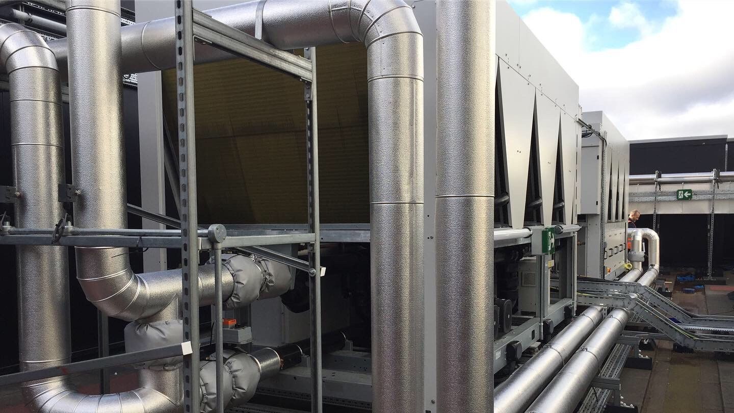 AC roof chiller pipework insulated and weather protected with aluminium cladding by Lagforce.