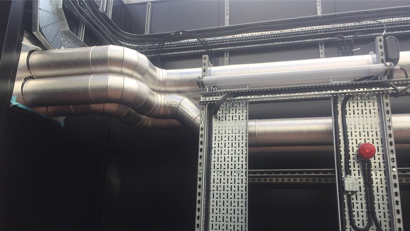 External pipework for AHU unit insulated with foiled fiberglass and clad with aluminium