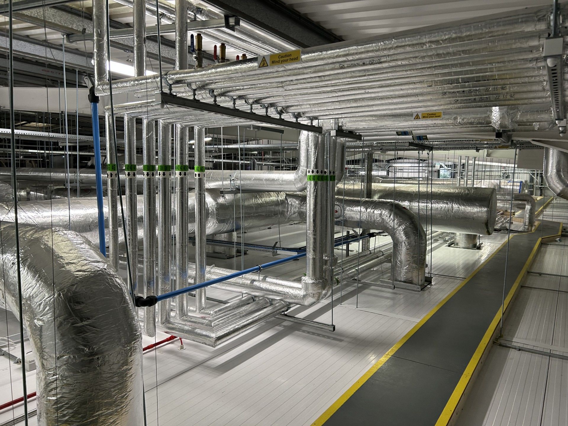 Ventilation ducting and water services pipework insulated with foiled fiberglass by Lagforce in Nass in Kildare