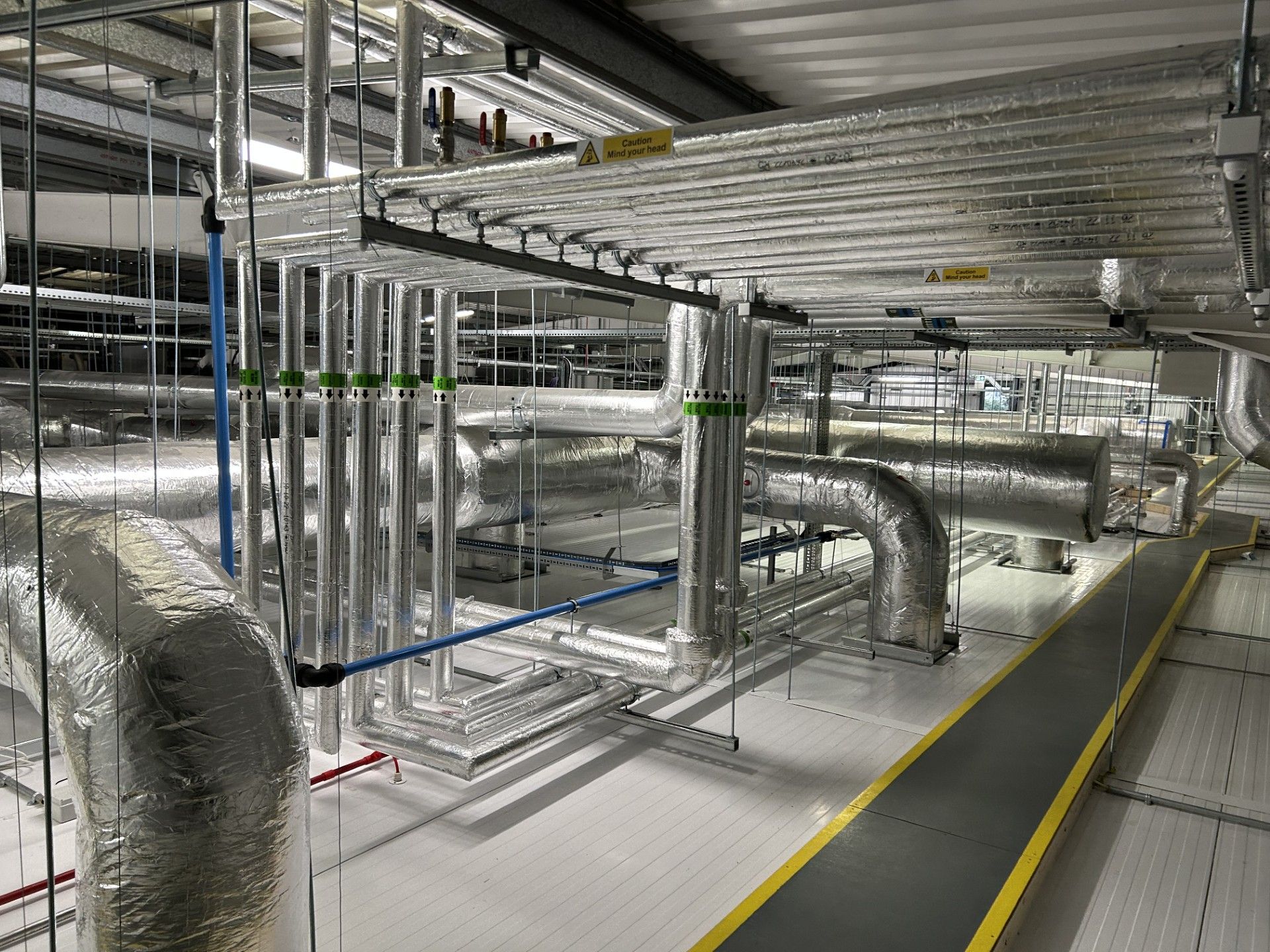 Ventilation ducting and water services pipework insulated with foiled fiberglass by Lagforce in Nass in Kildare