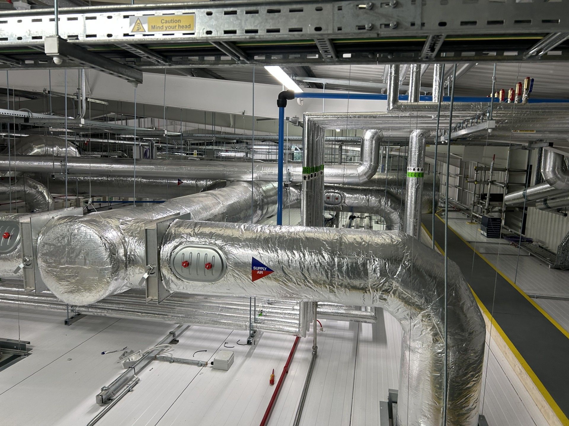 Ventilation ducting and water services pipework insulated with foiled fiberglass by Lagforce in Nass in Kildare