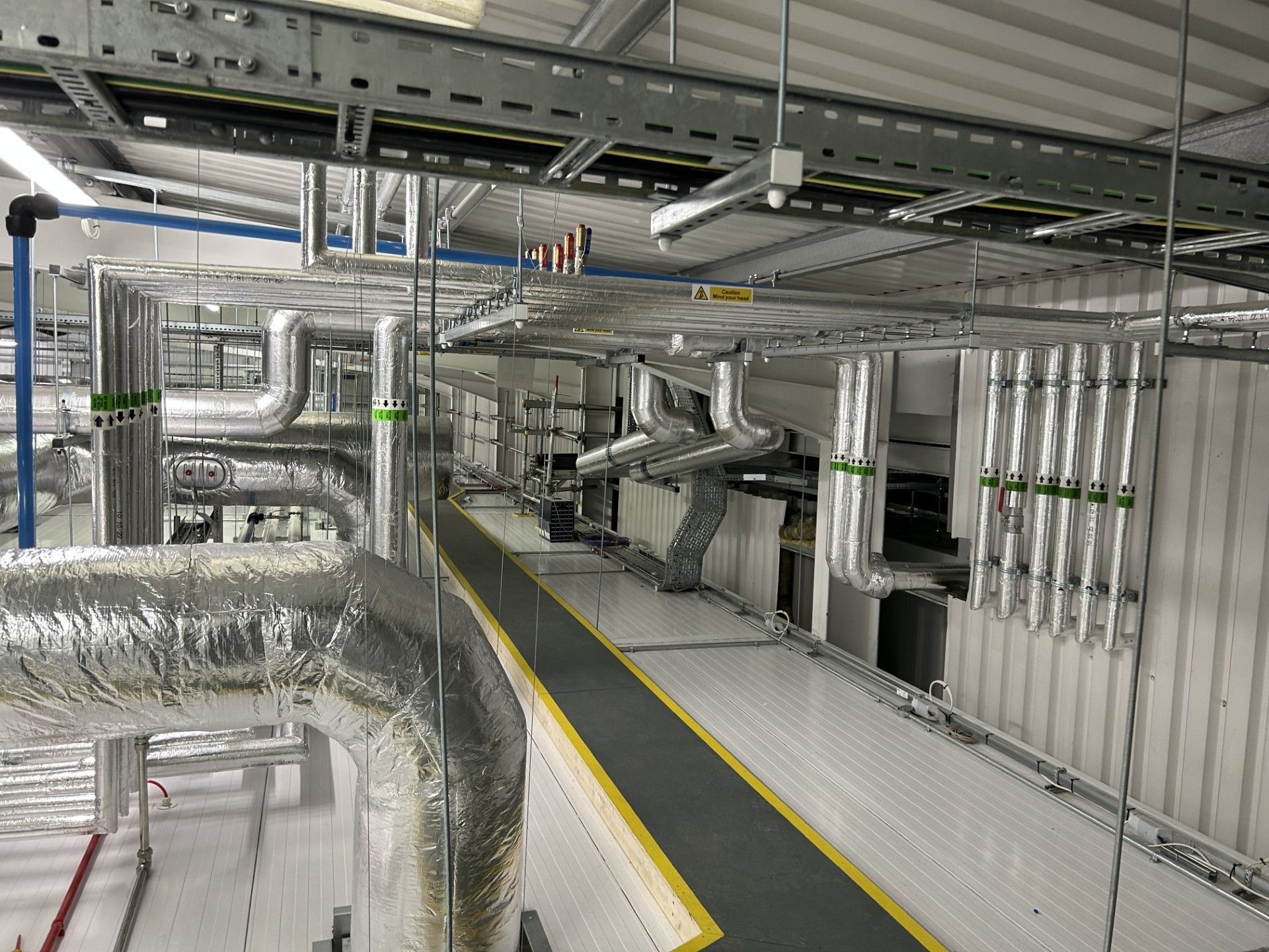 Ventilation ducting and water services pipework insulated with foiled fiberglass by Lagforce in Nass in Kildare