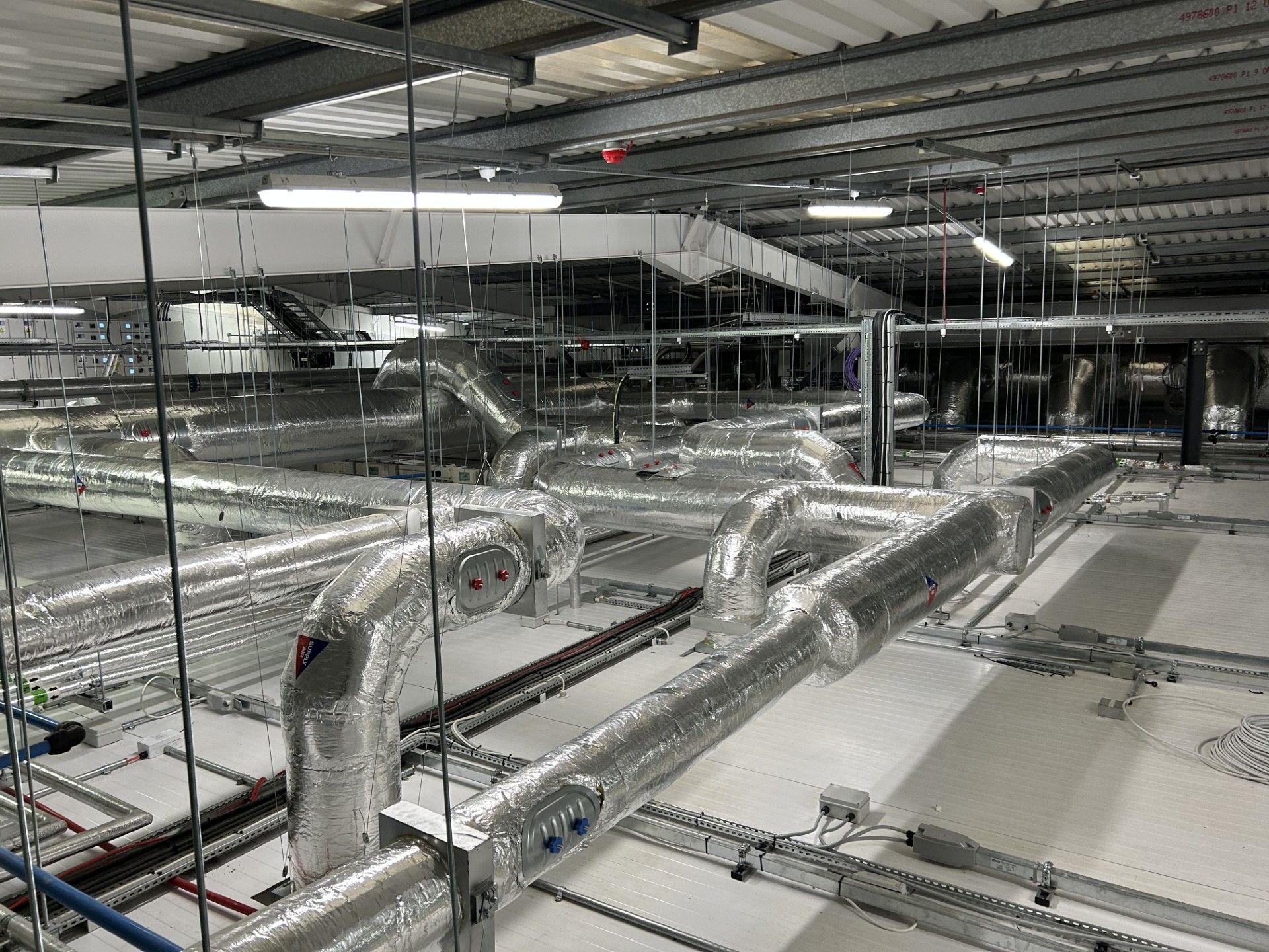 Ventilation ducting and water services pipework insulated with foiled fiberglass by Lagforce in Nass in Kildare
