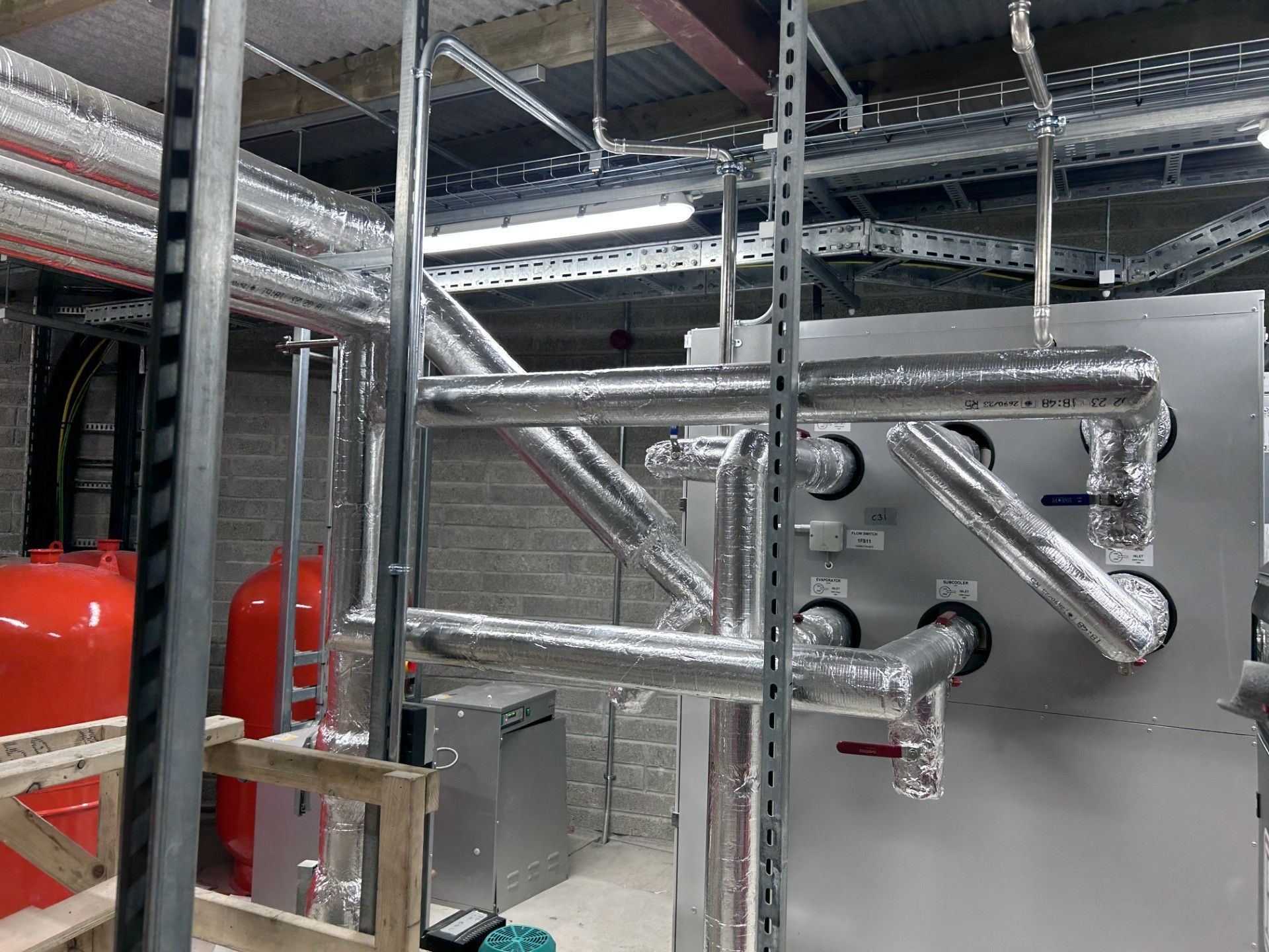 Steam pipework in a distillery insulated with high thermal efficiency insulation sections 