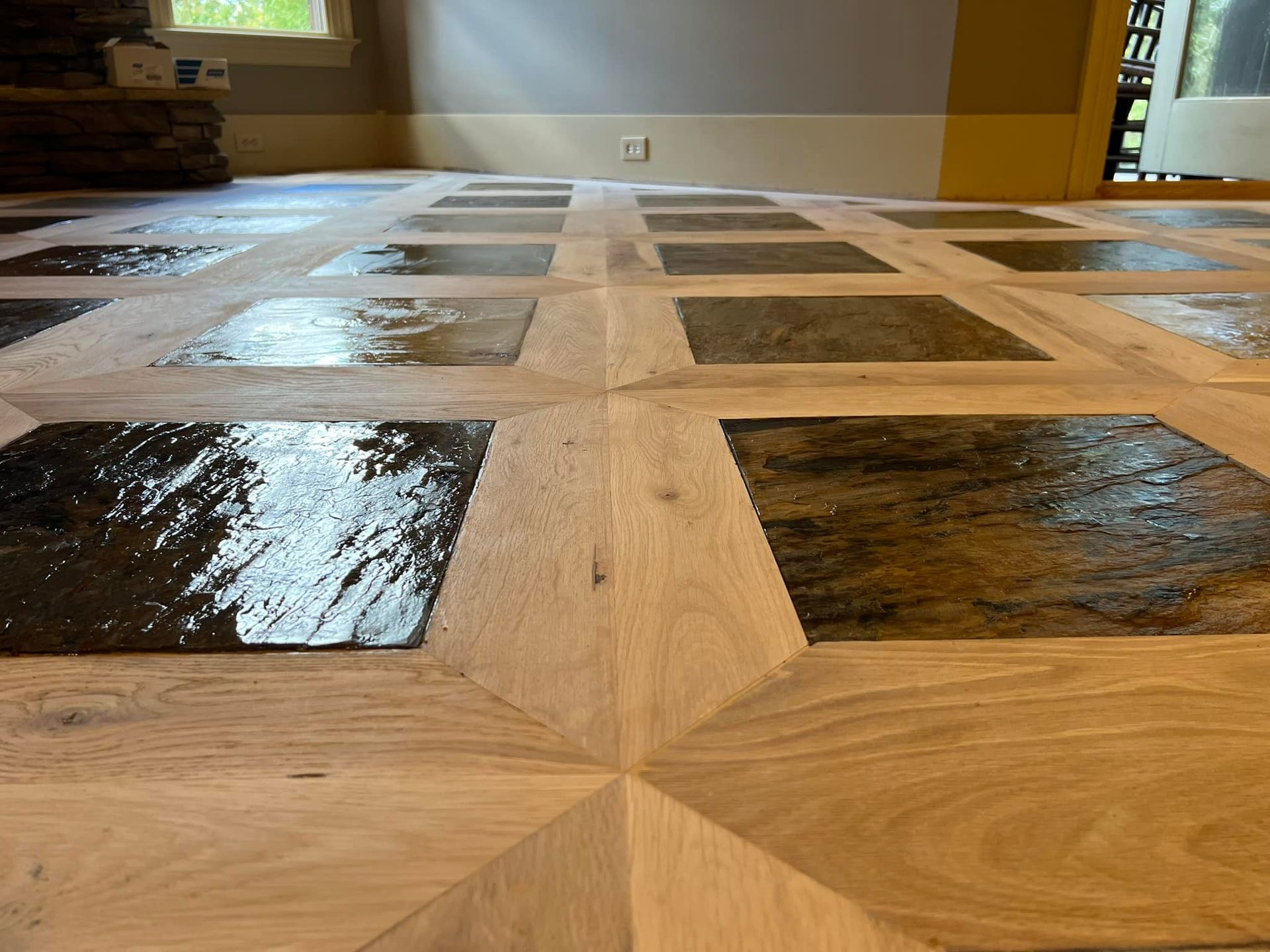 A wooden floor with a pattern of squares on it