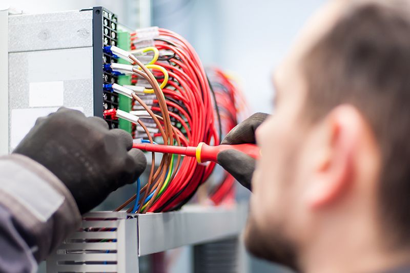 Electrician Checking The Electrical Wirings