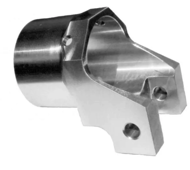 A close up of a metal object with a hole in the middle