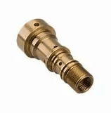 A close up of a brass cylinder on a white background.