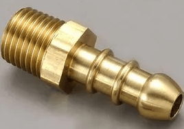 A close up of a brass hose connector on a gray surface.