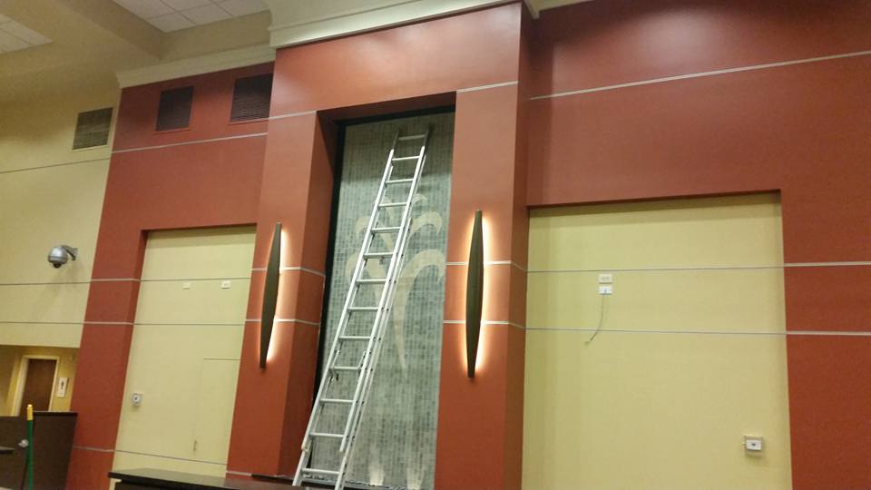 A ladder is leaning against a wall in a building