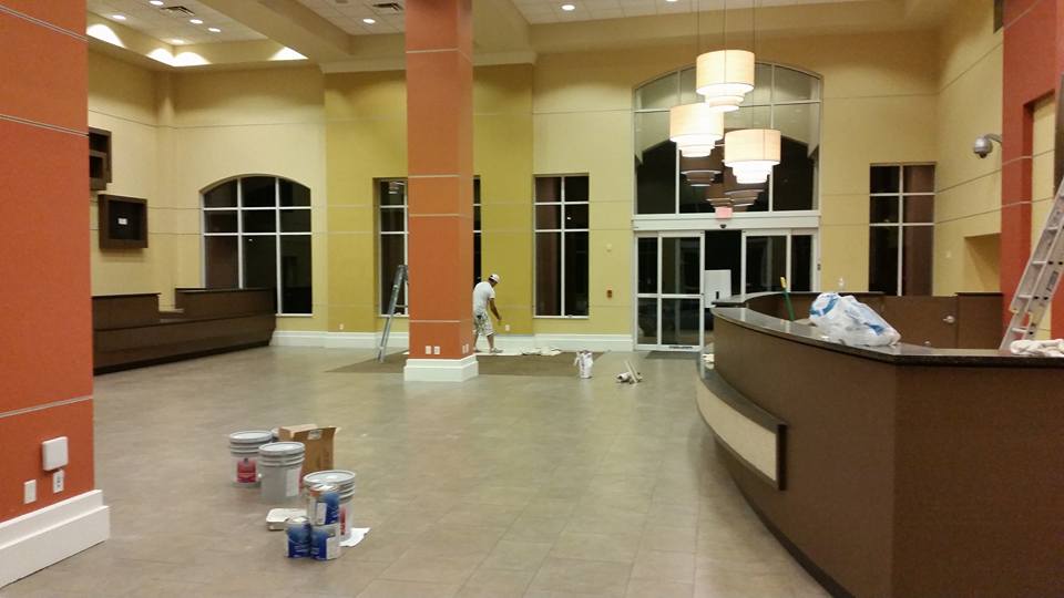 A man is painting the walls of a building