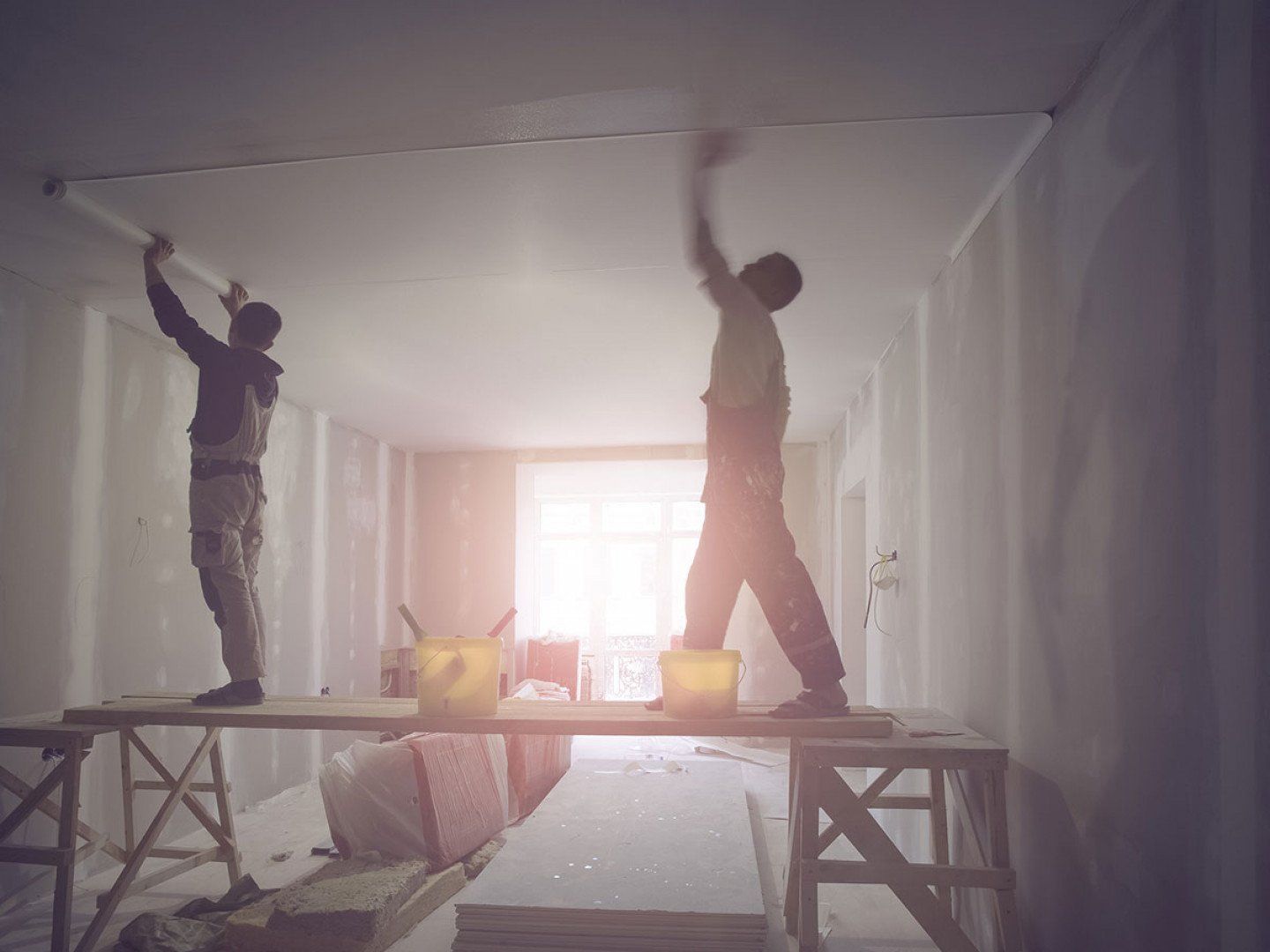 2 men painting the ceiling