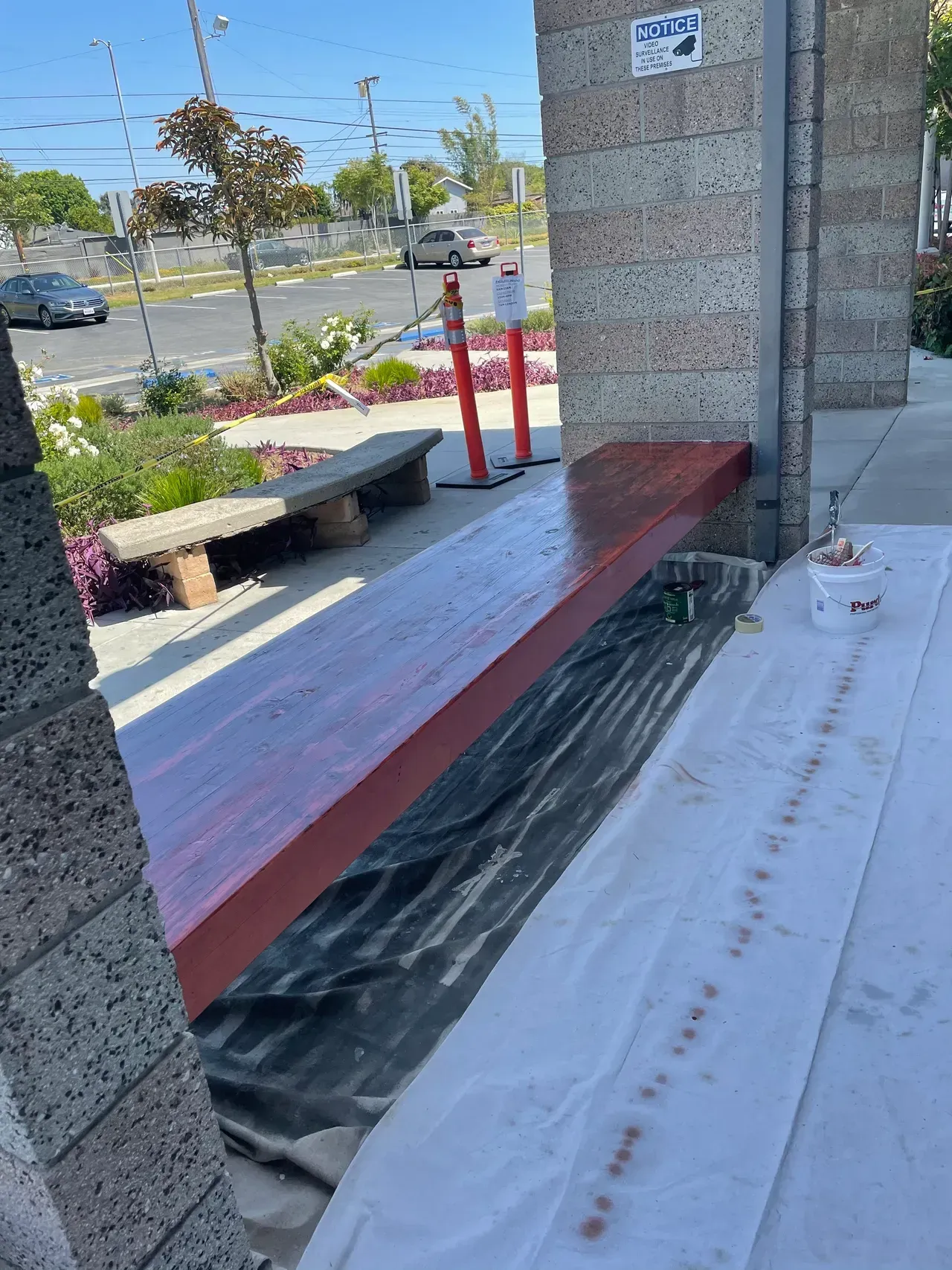 A man is plastering a wall with a trowel.