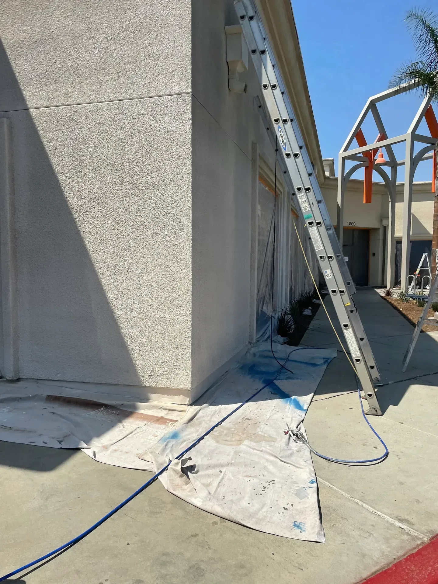 A ladder is leaning against the side of a building.