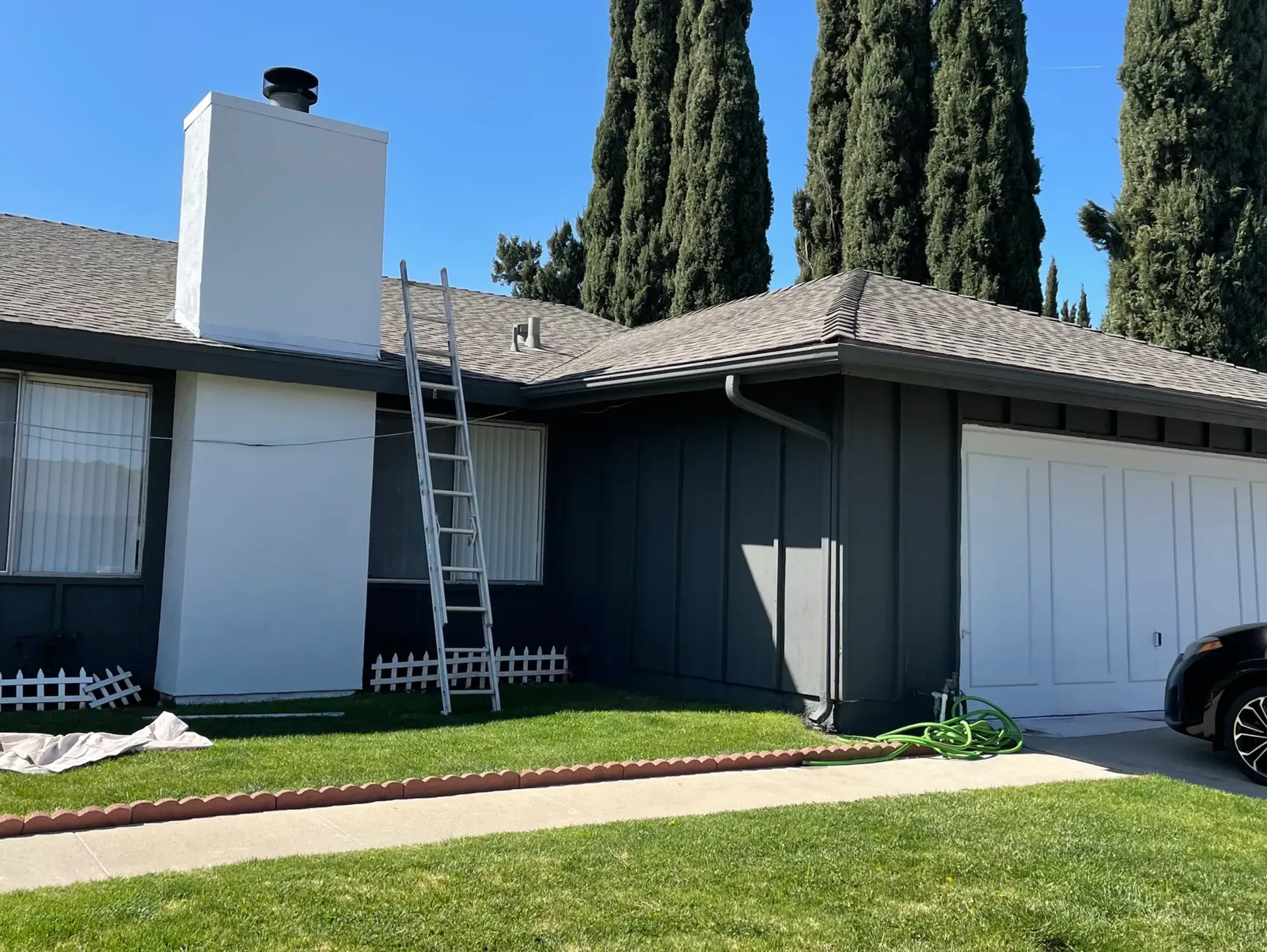 A house with a ladder on the side of it