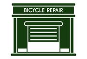 It is a bicycle repair shop with a green building.