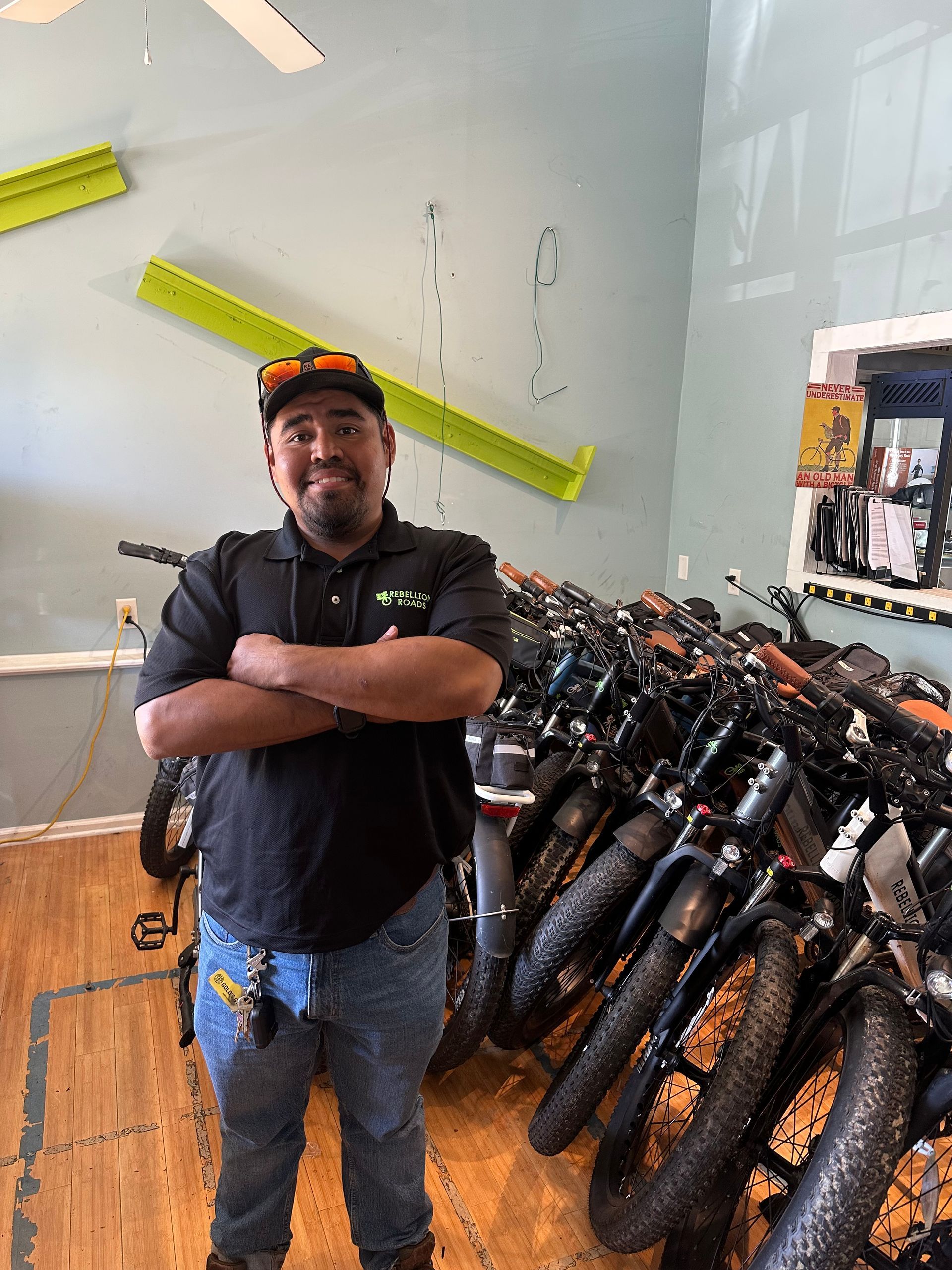 Our Tour guide in front of a row of ebikes.