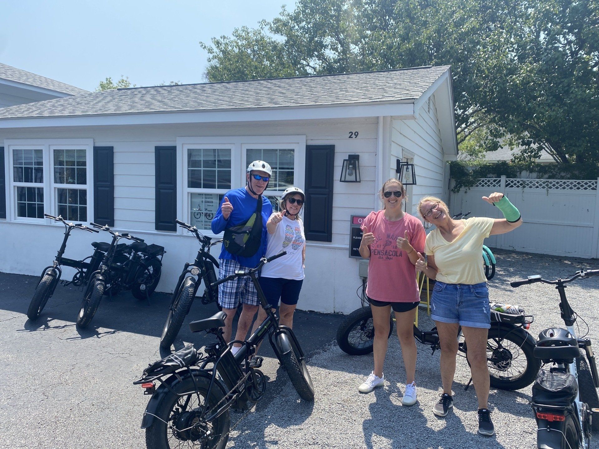 Family With Their Bikes Posing For A Photo