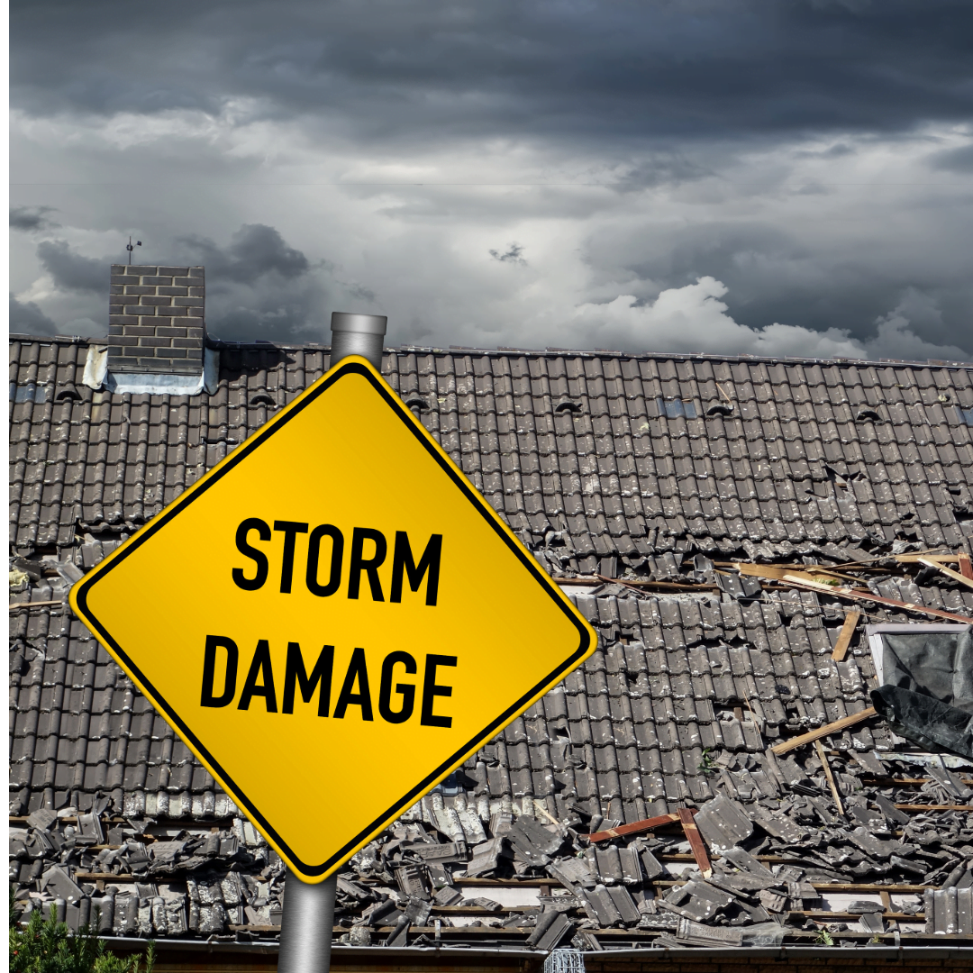 A yellow sign that says storm damage on it in front of a damaged roof.