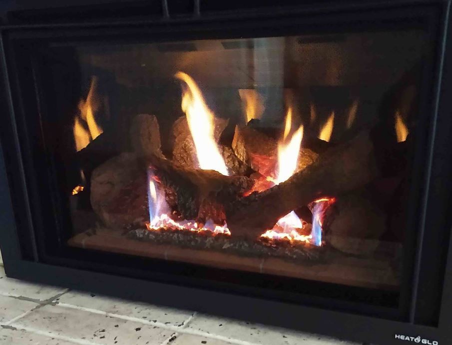 A fireplace with a lot of fire in it