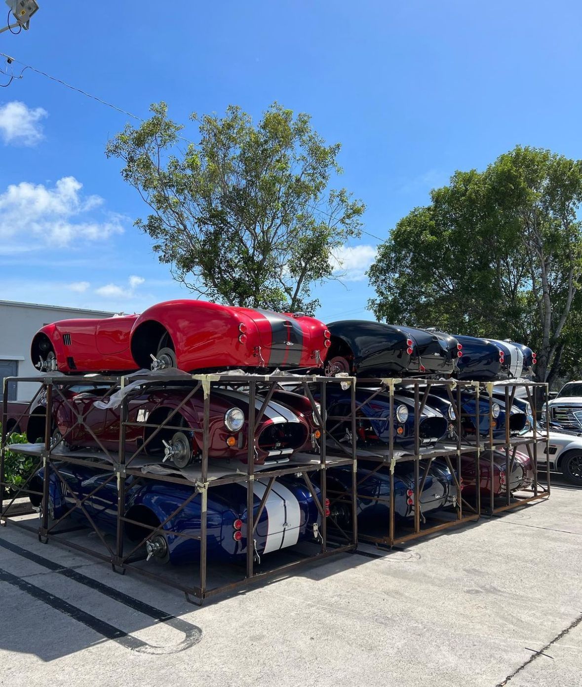 A bunch of cars are stacked on top of each other