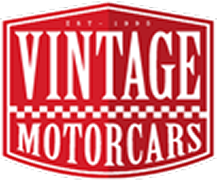 A red and white logo for vintage motorcars.