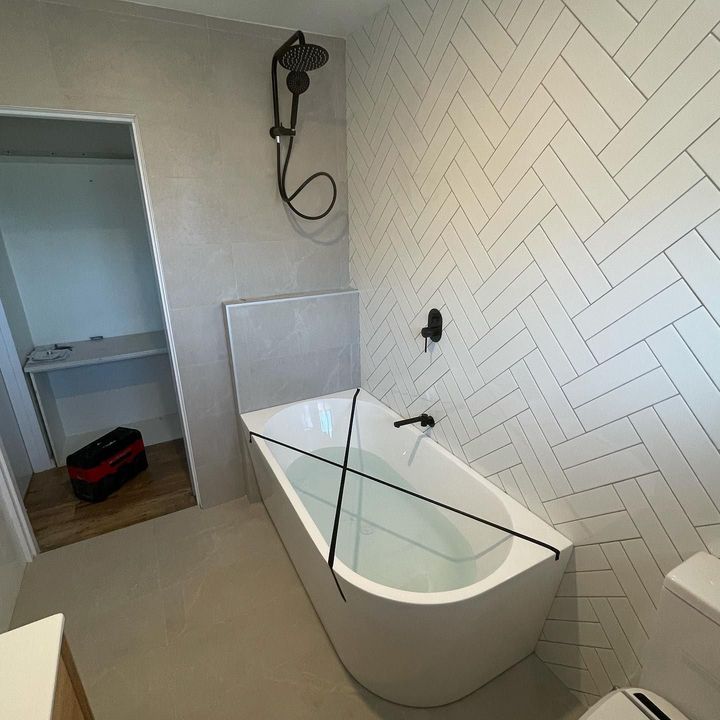 Newly Installed White Bath Tub — Plumbers in Illawarra, NSW