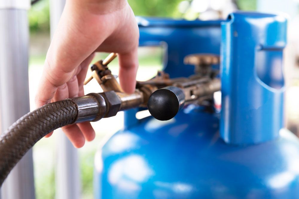 Bunch of LPG gas cylinders for kitchen — Plumbers in Illawarra, NSW