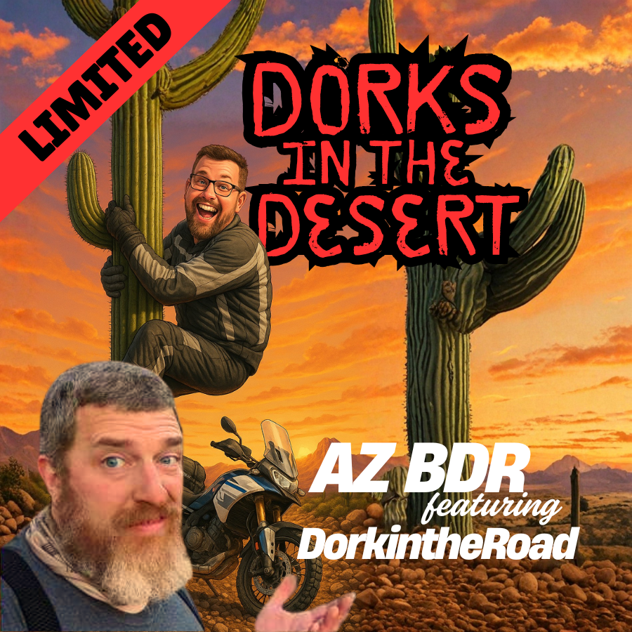 A dirt road in the middle of a desert with mountains in the background.